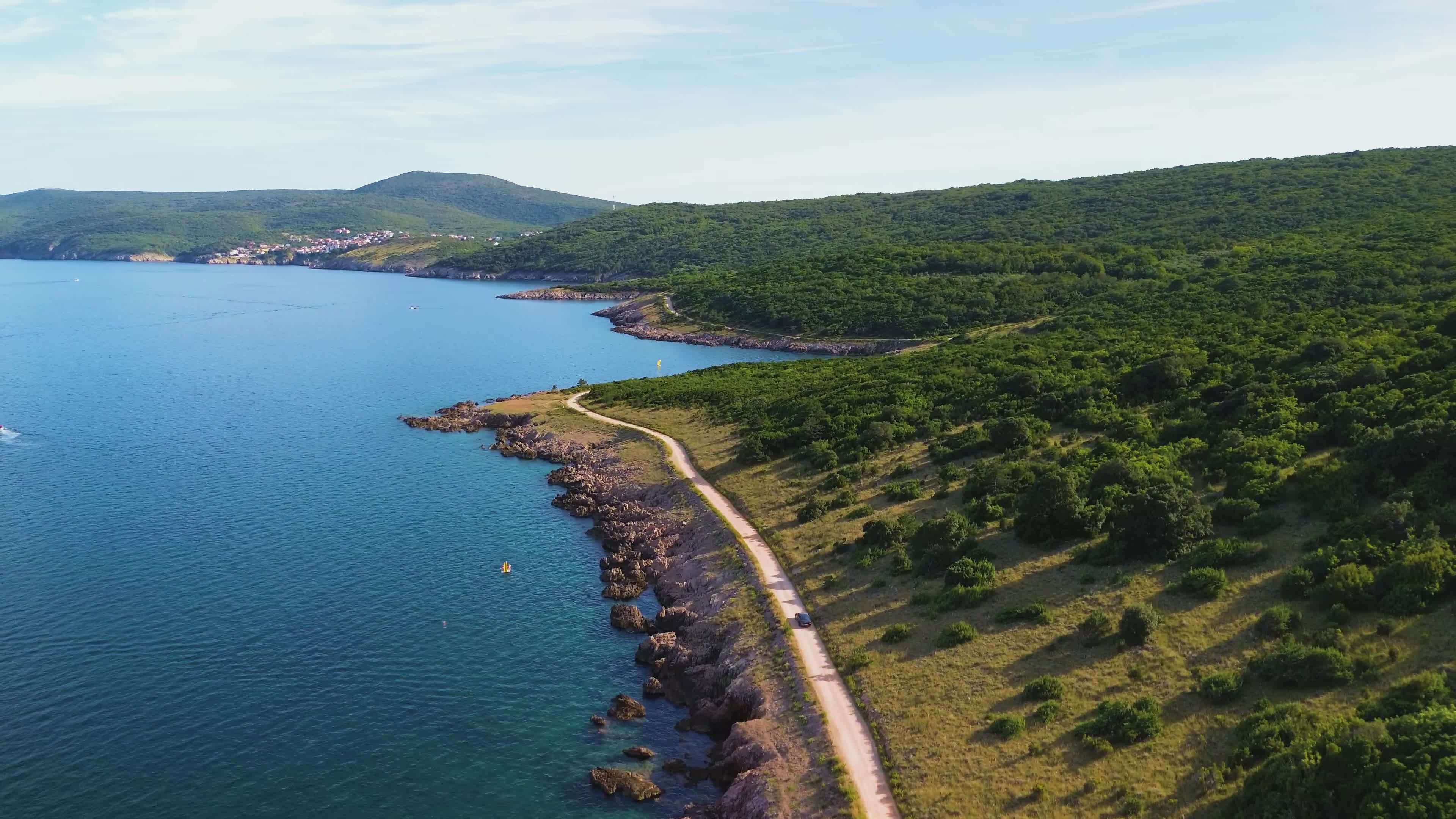 Scenic Coastal Road with Lush Greenery in Summer Free Stock Video ...