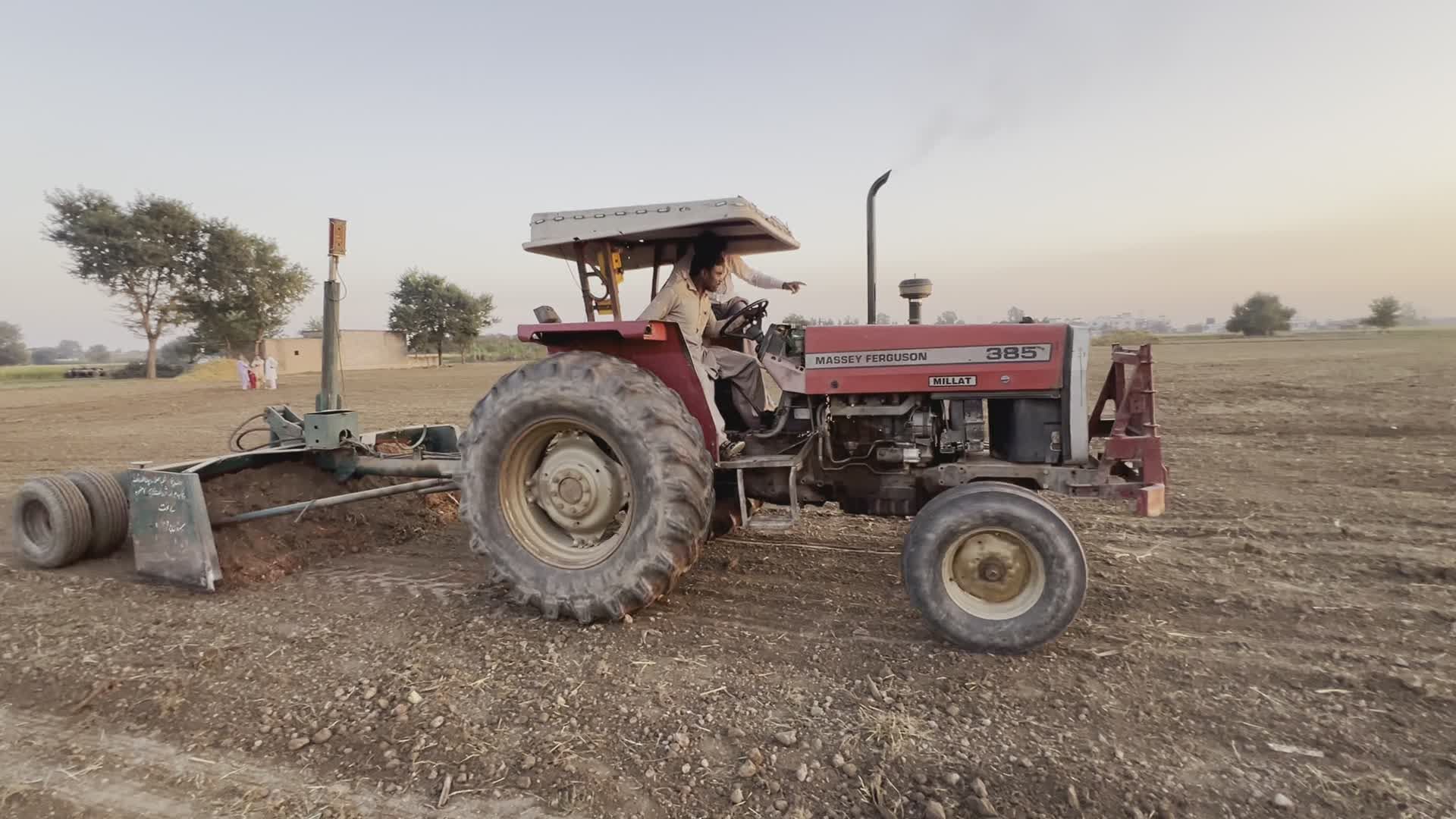 Farmer Operating Tractor for Field Preparation at Sunset Free Stock ...