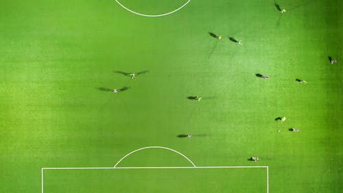 A Game Of Soccer Being Played In A Soccer Field