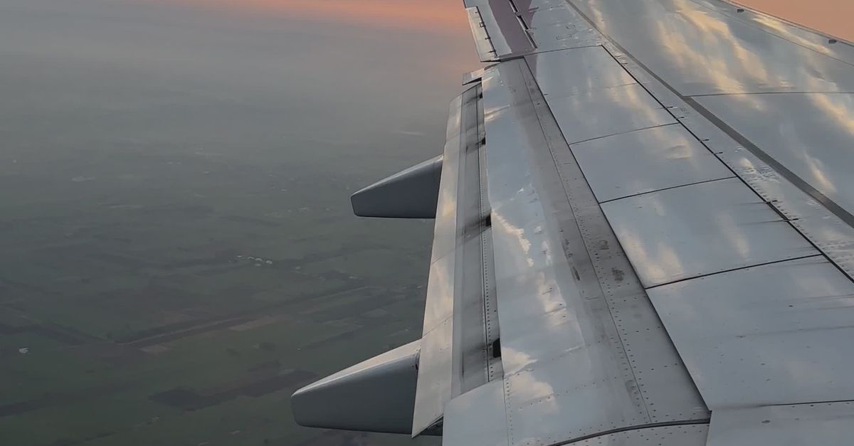 Scenic Aerial View from Airplane Window at Sunset Free Stock Video ...