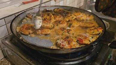 street food vendor cooking delicious savory patties