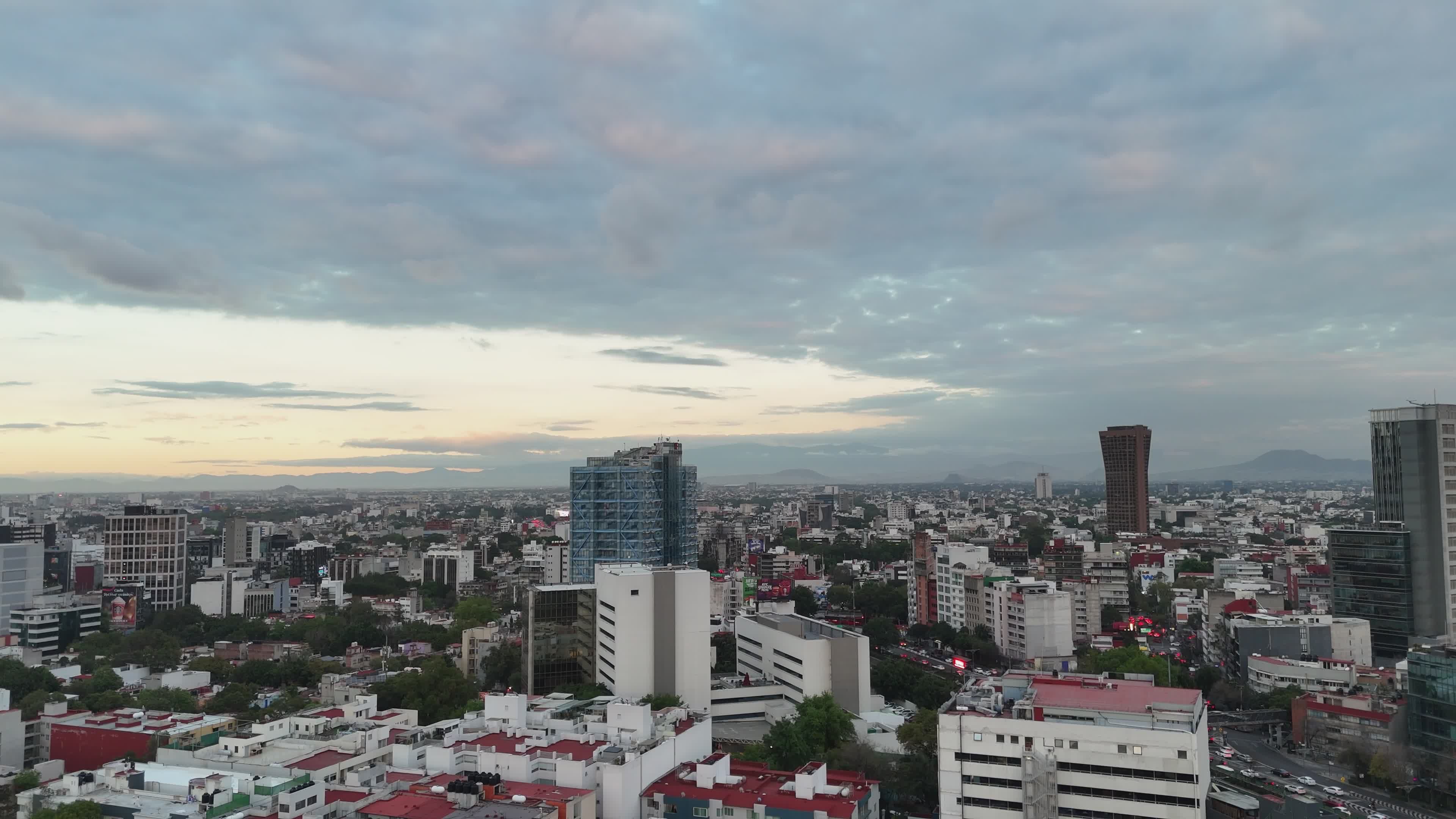Drone Footage of City Buildings Under White Clouds Free Stock Video ...
