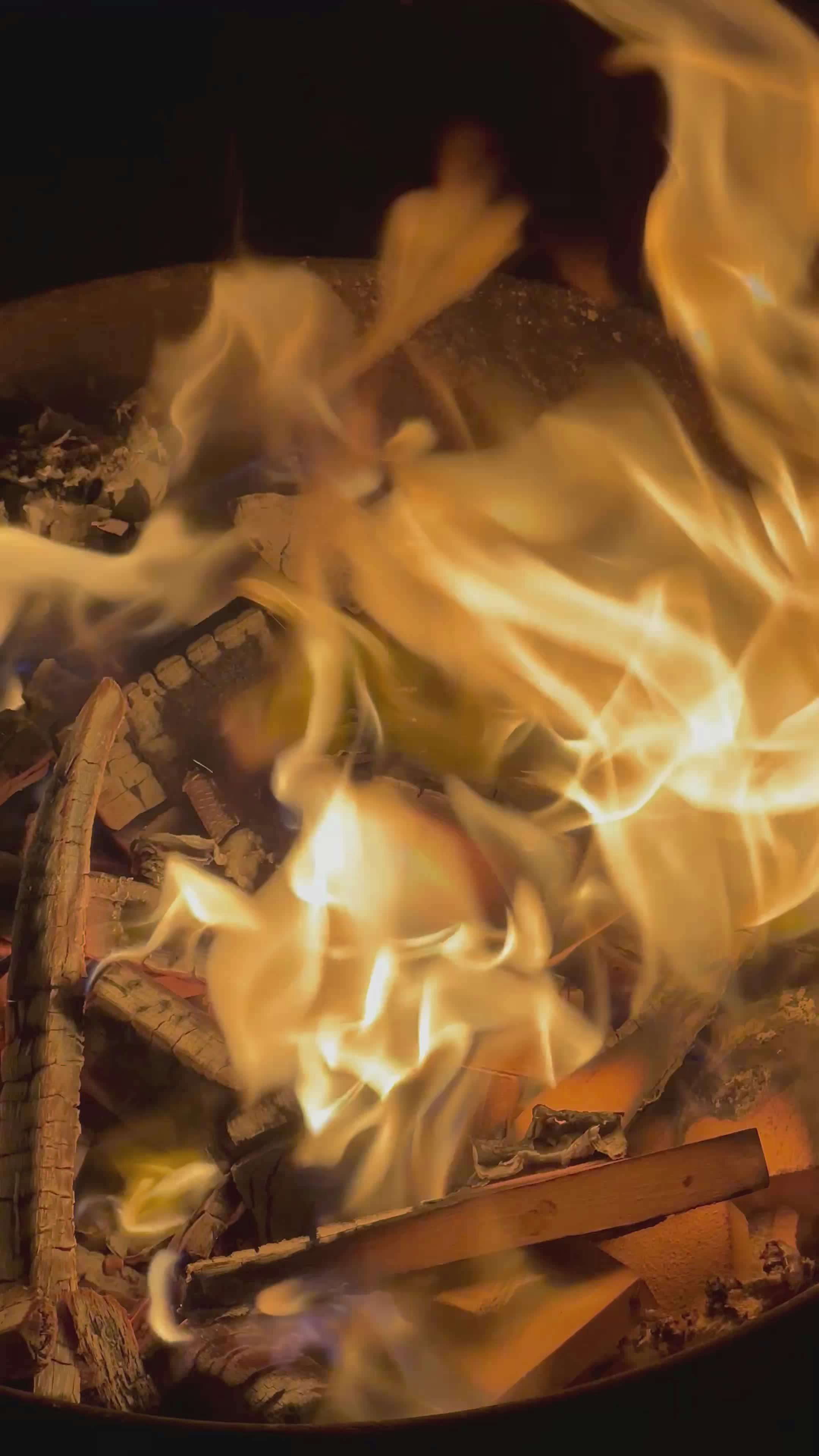 close up flames and wood burning in fire pit 35239445