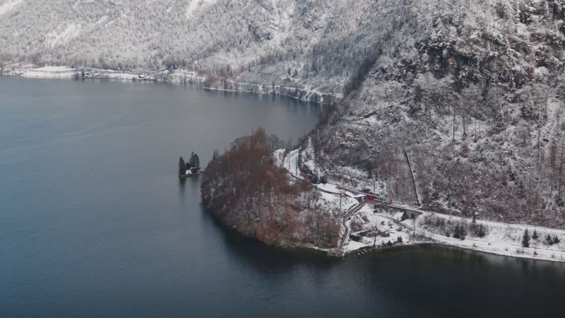 Aerial view of snowy alpine lake in winter