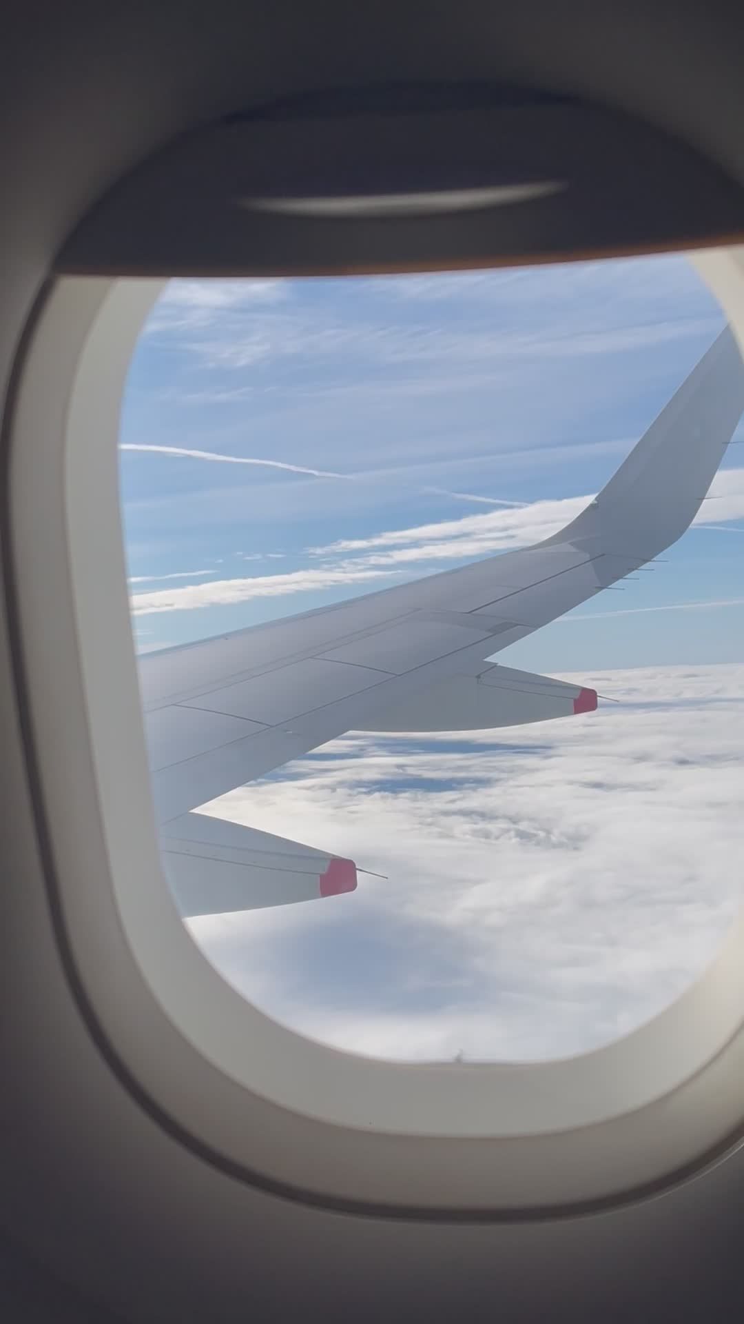 airplane-wing-view-above-the-clouds-free-stock-video-footage-royalty