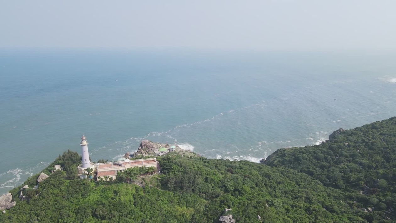 Aerial Coastal View with Lighthouse and Lush Greenery Free Stock Video ...