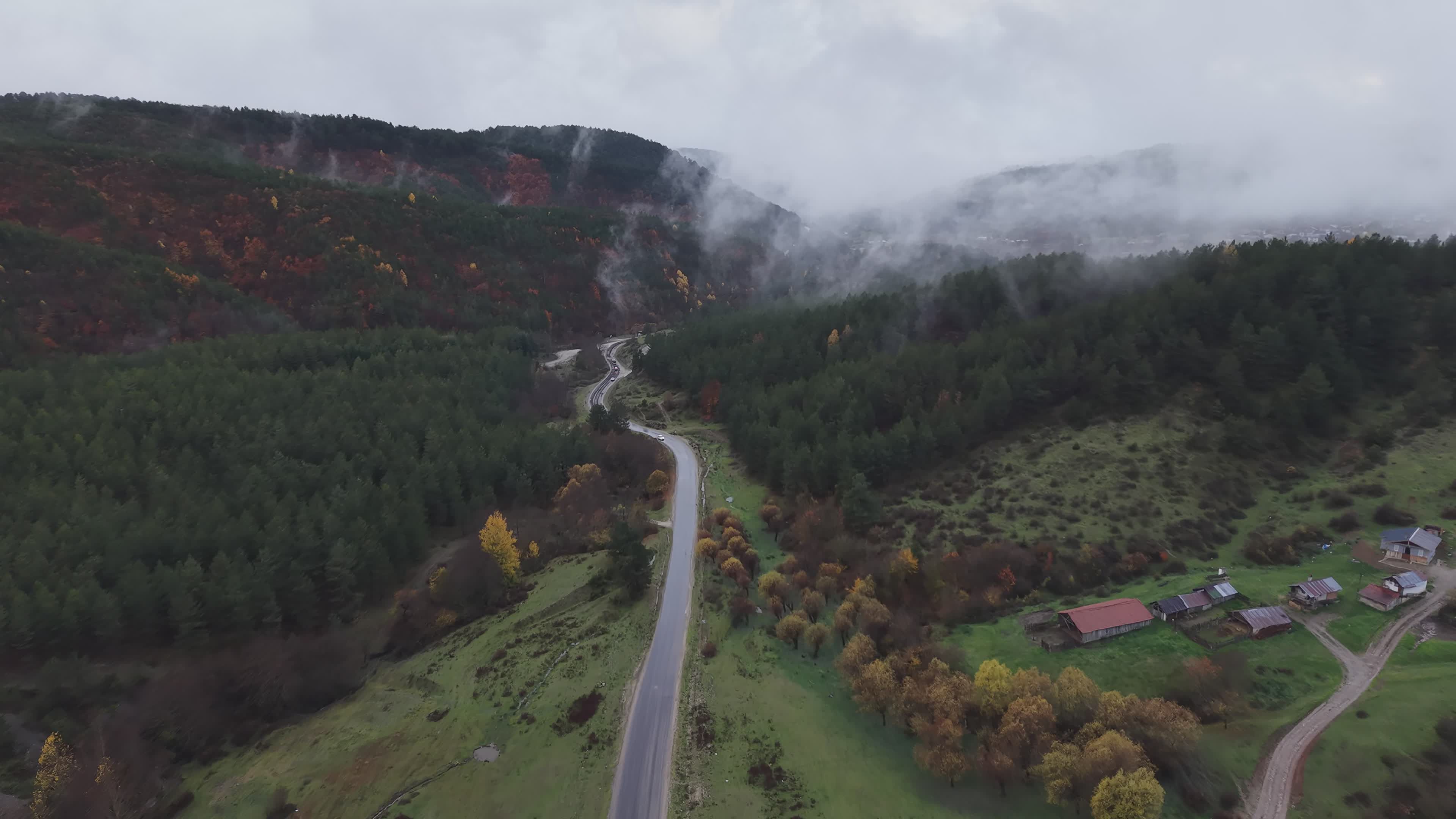 Serene Aerial View of Misty Mountain Road Free Stock Video Footage ...