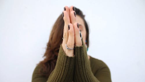 A Woman Hands Is Gestured In A Praying Position