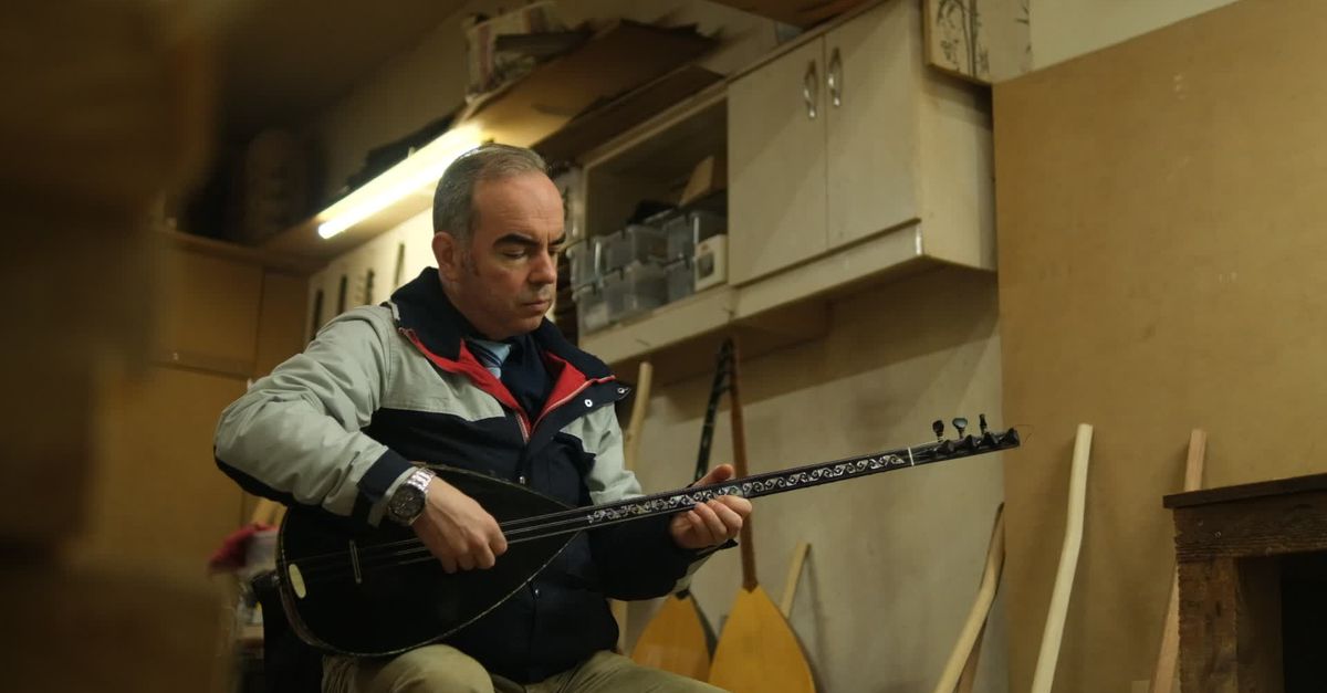 Stringman Instrument Man Playing Traditional String Instrument in Workshop Free Stock Video ...