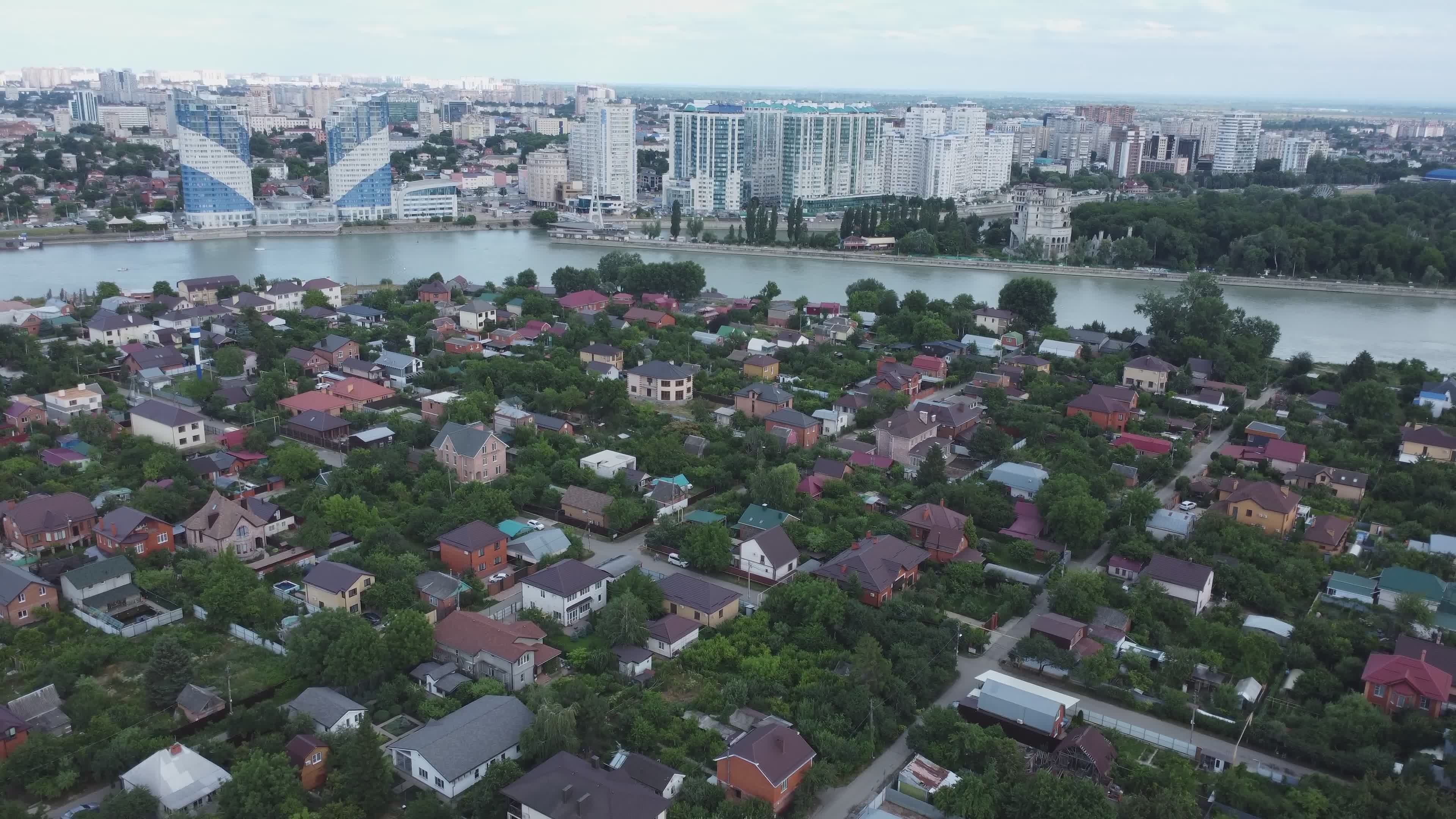Aerial View of Riverside Neighborhood and Cityscape Free Stock Video ...