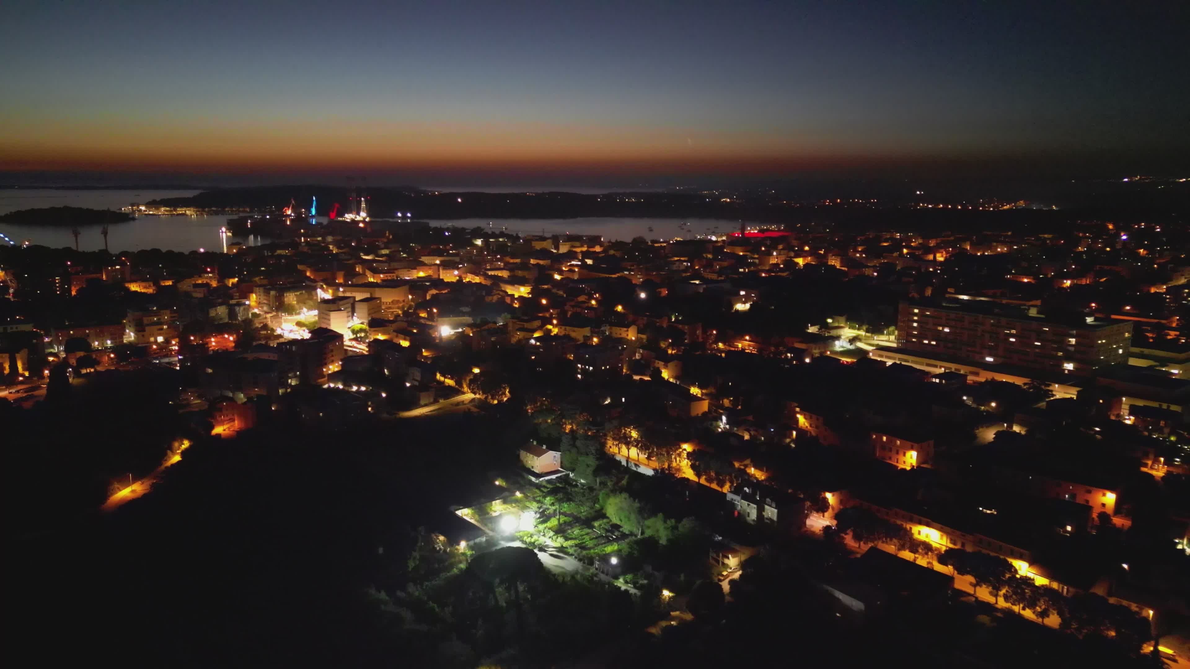 Aerial Night View of a Vibrant Coastal Cityscape Free Stock Video ...