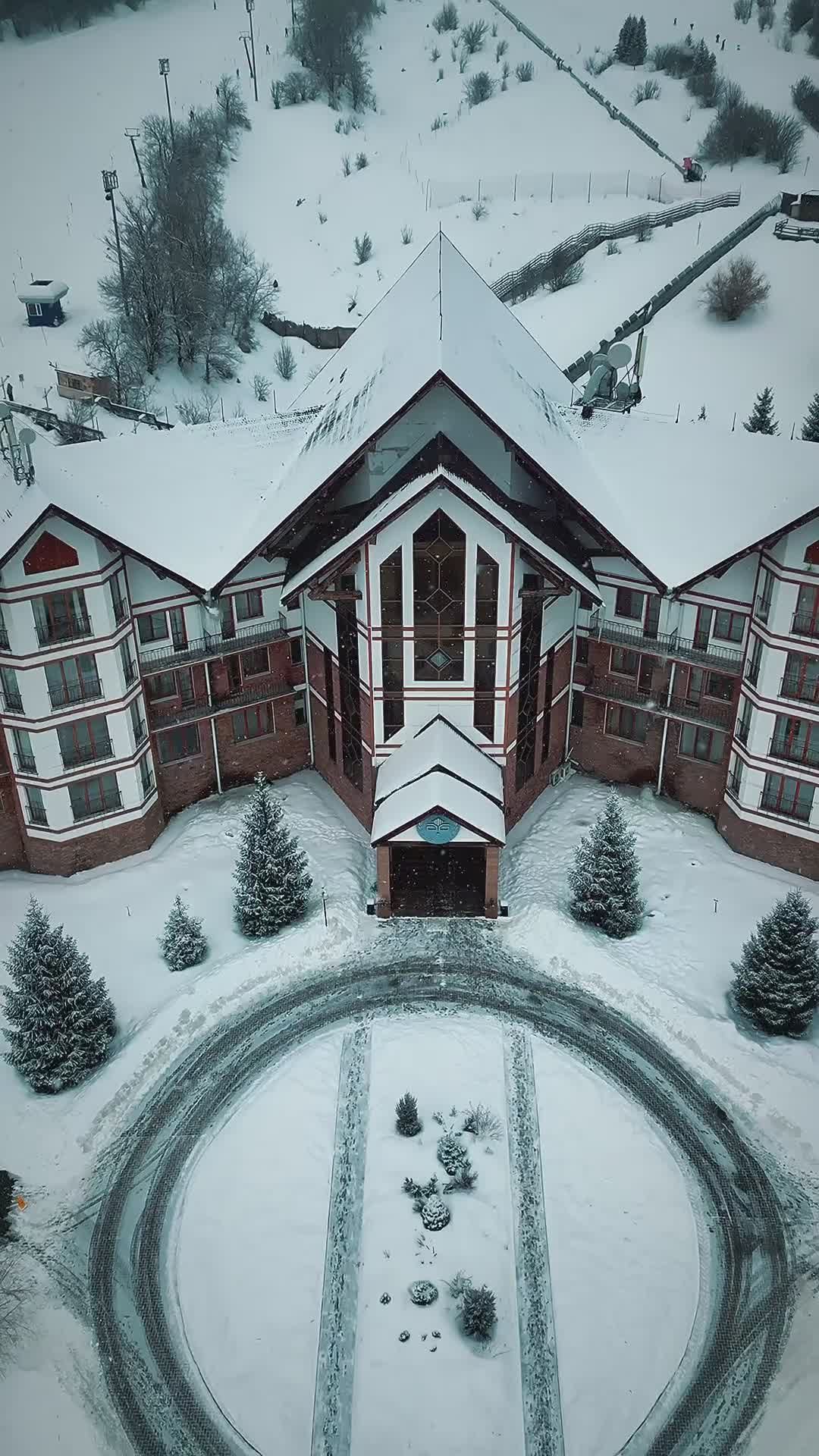 Aerial View of Snow-Covered Mountain Lodge Free Stock Video Footage ...