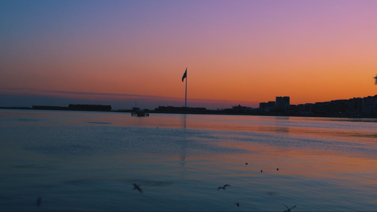 Serene Sunset Over Calm Waters with Birds Free Stock Video Footage ...