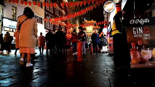 People Walking On A Busy Street In China Town Of London City