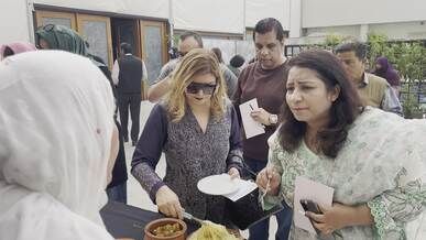 women enjoying traditional pakistani cuisine