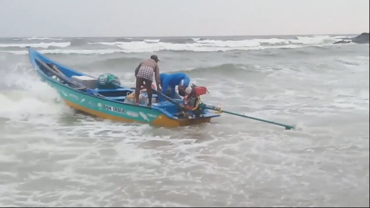 A Fishing Boat Floating Through Strong Waves Towards The Open Sea