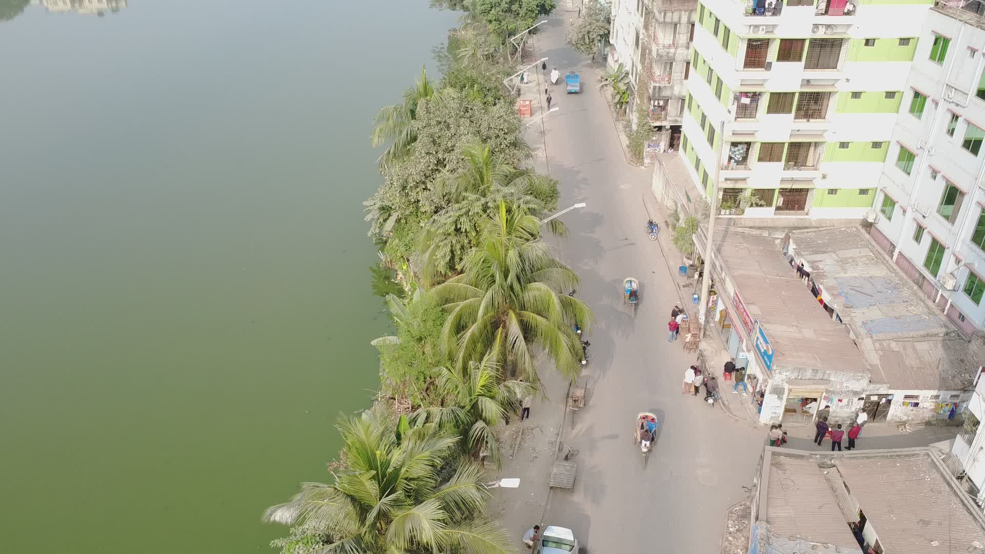 Aerial View of Urban Riverside with Greenery Free Stock Video Footage ...