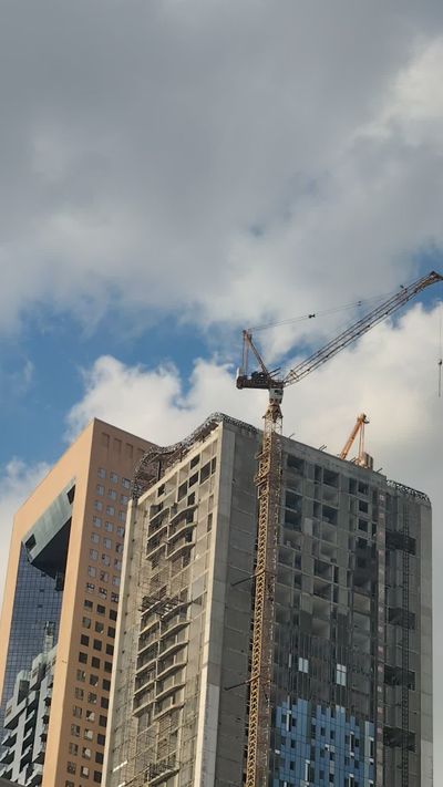 Urban Highrise Construction with Crane Timelapse Free Stock Video ...