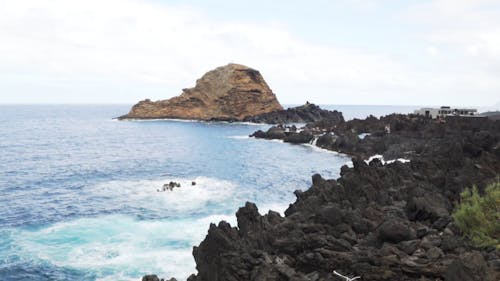 Natural Black Rocks Formation On The Seashore In Porto Moniz, Portugal