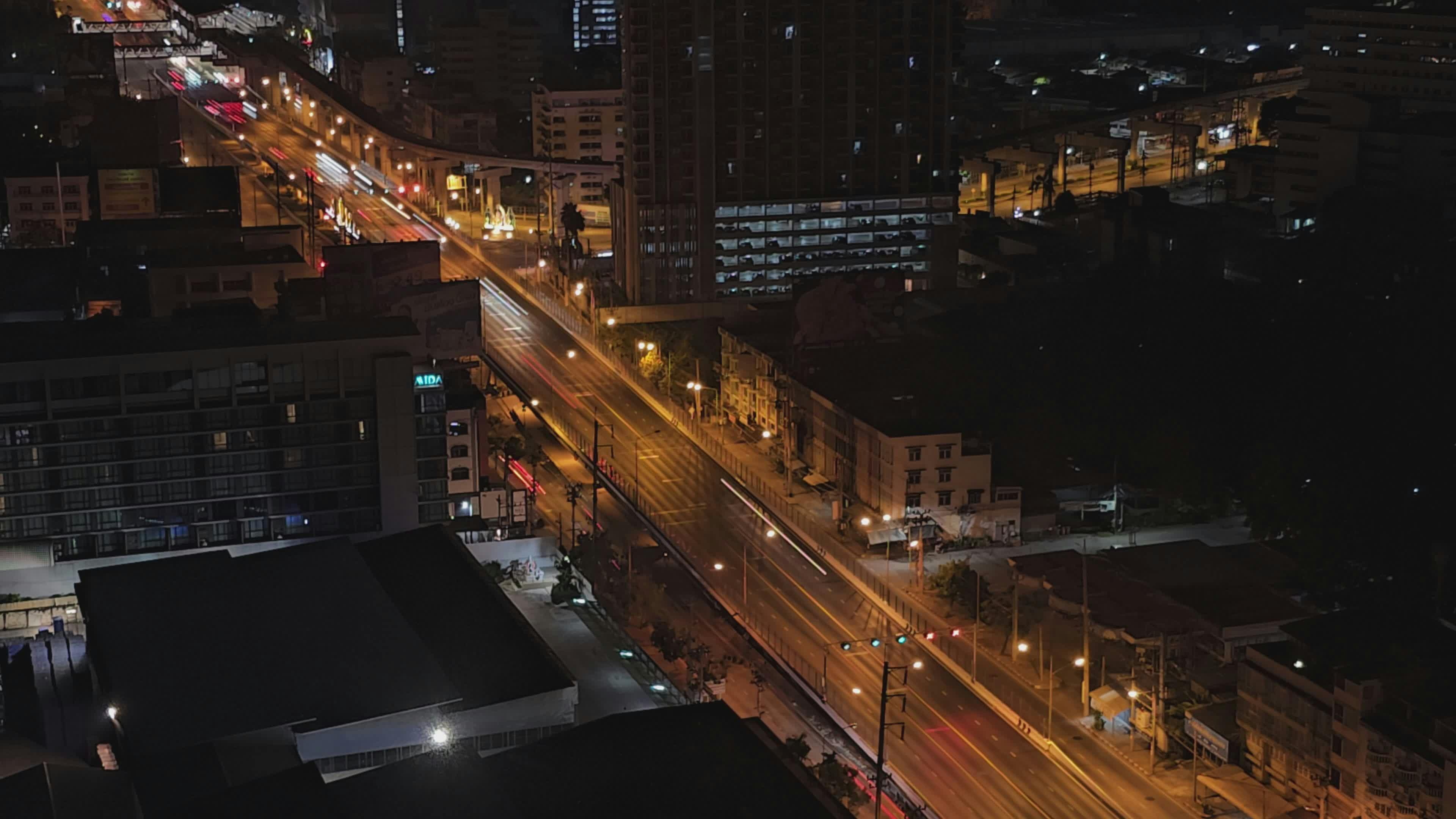 city streets at night with light trails 35556759