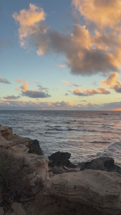 Women Manifest Success's ocean waves sunset video