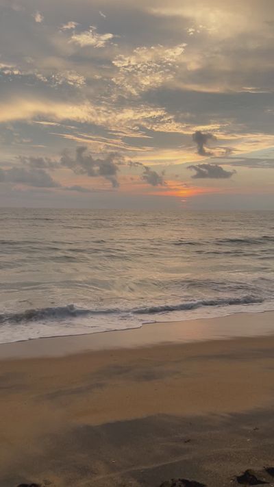 Thanzeena Husain's ocean waves sunset video