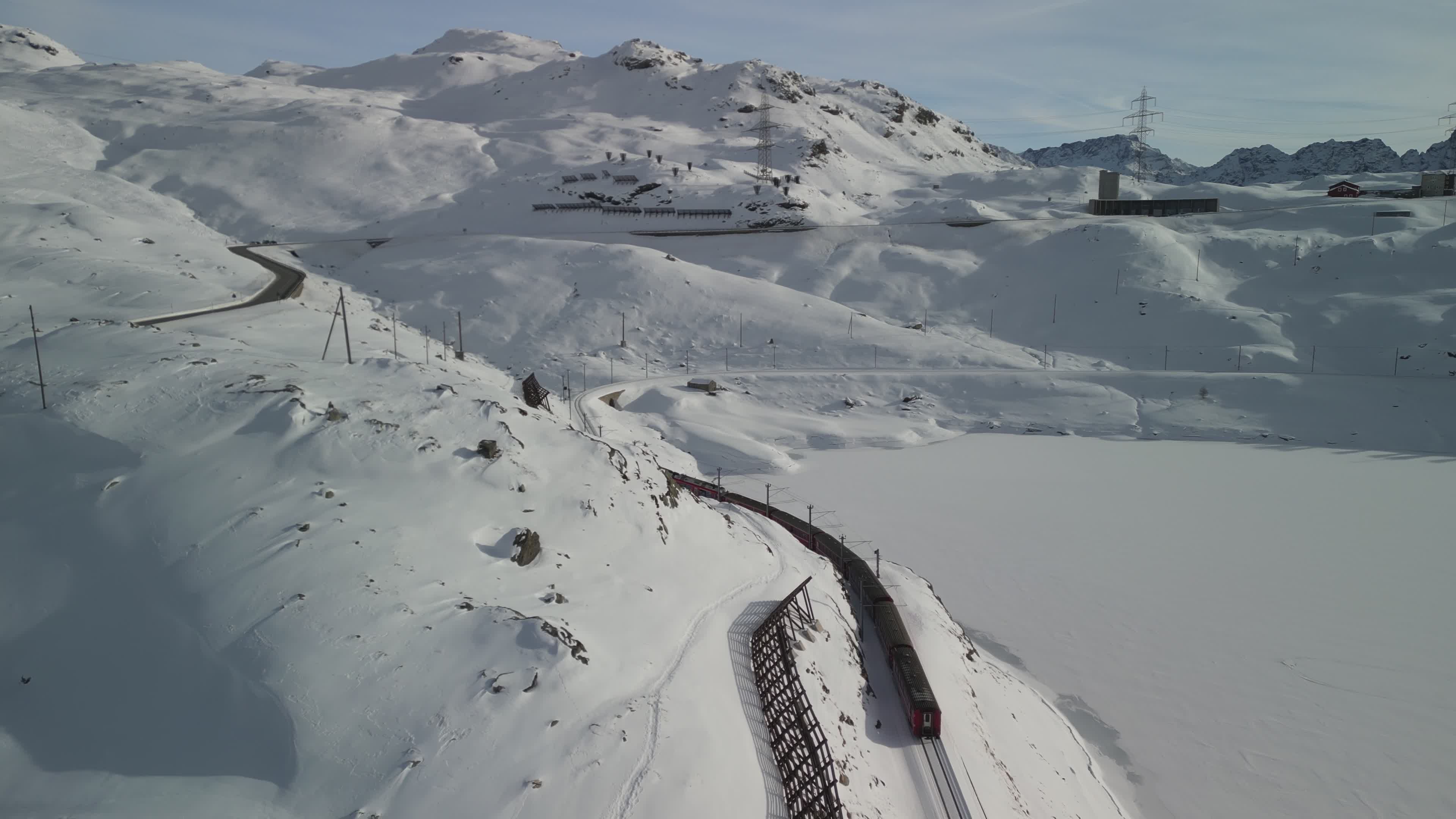 Aerial View of Train Passing Through Alpine Snow Free Stock Video ...