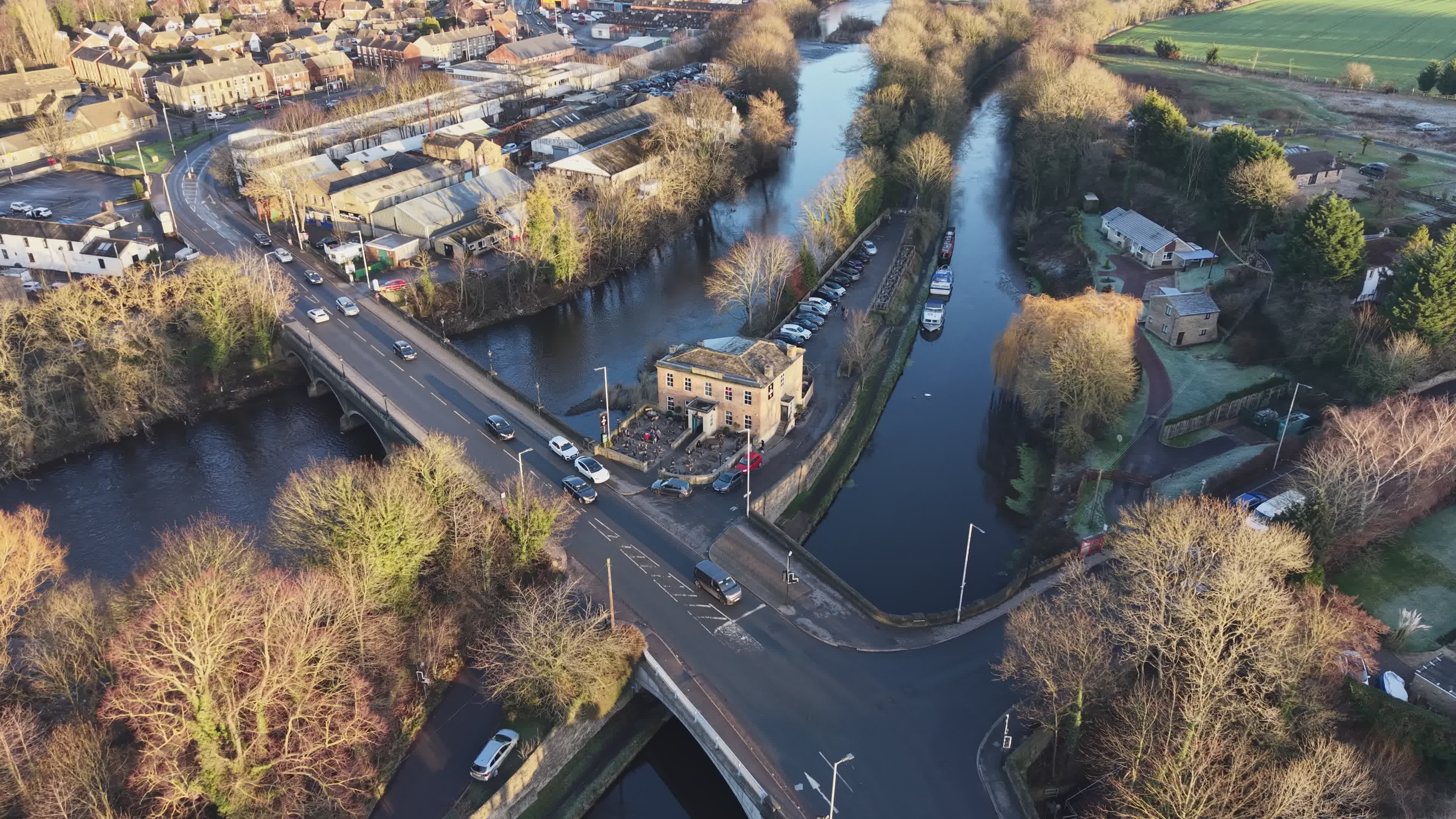 Aerial View of Riverside Town Bridge and Buildings Free Stock Video ...