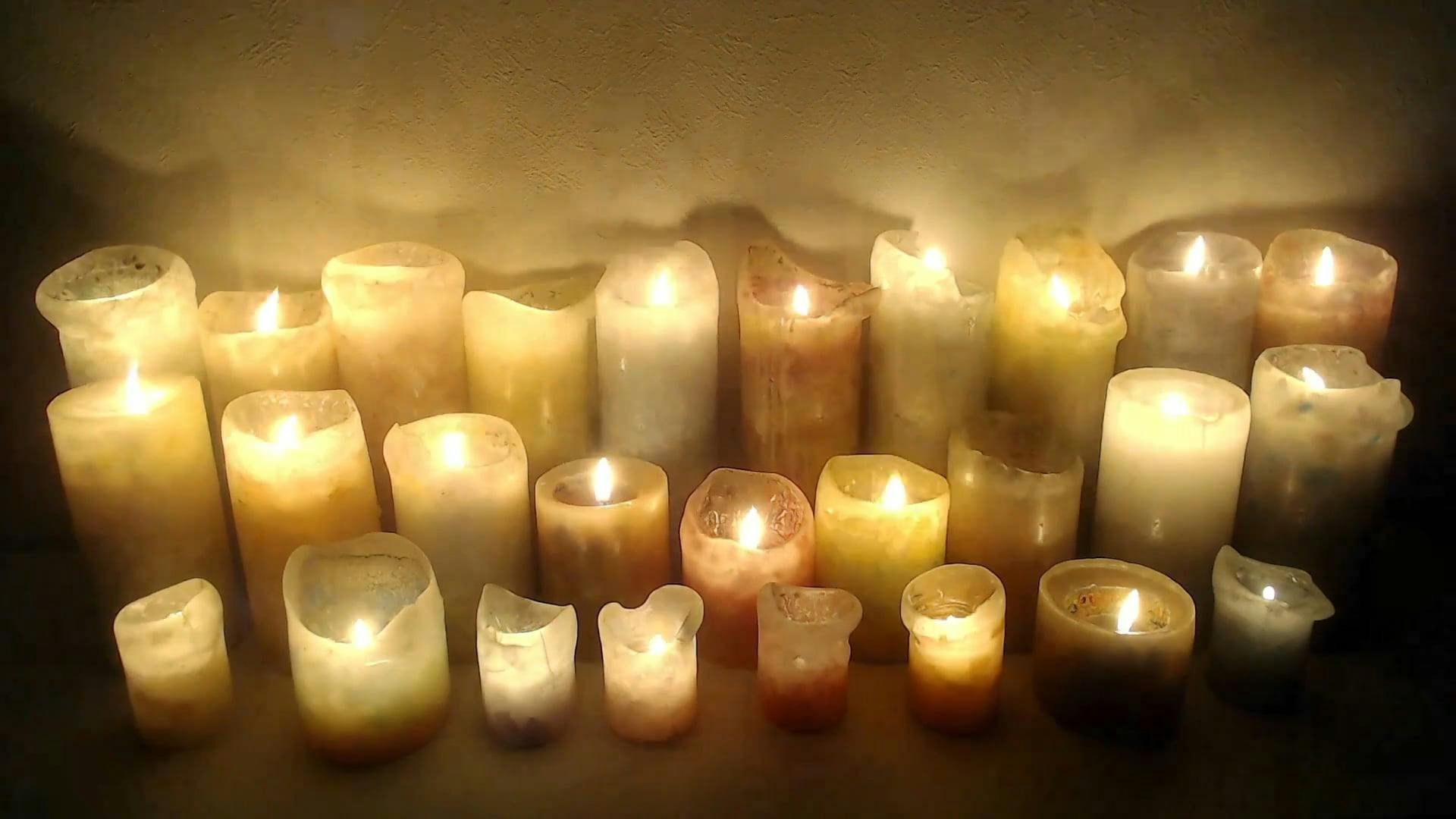 A Lighted Candles Giving Light To Darkness · Free Stock Video