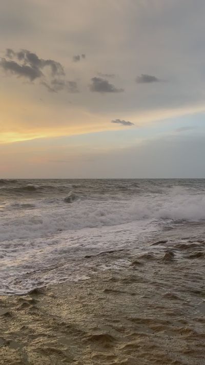 Thanzeena Husain's ocean waves sunset video