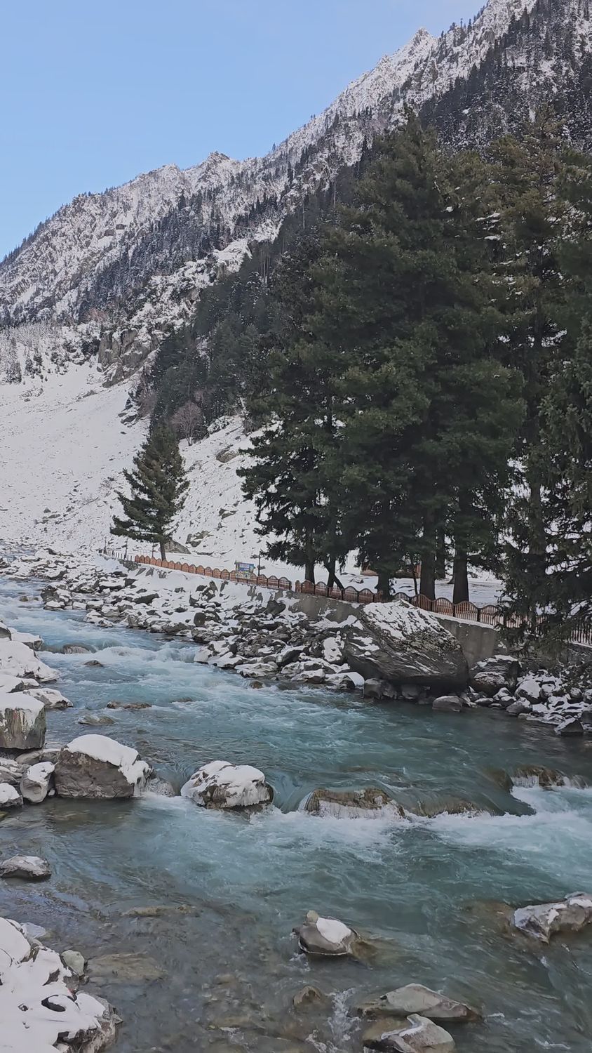Scenic Winter River Flowing Through Snowy Mountains Free Stock Video ...