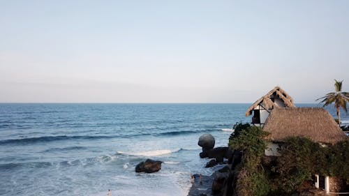 Aerial Footage Of A Beach Resort With Cottages