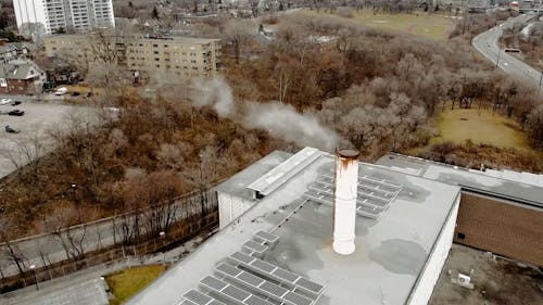 Smoke Coming Out Of A Manufacturing Plants's Chimney
