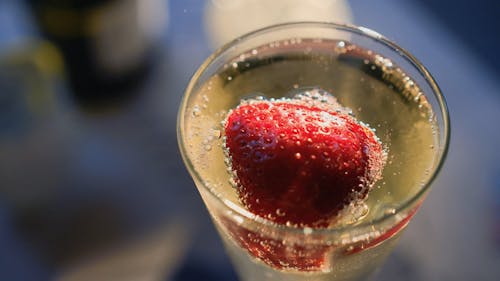 A Strawberry Fruit Mixed In An Alcoholic Drink