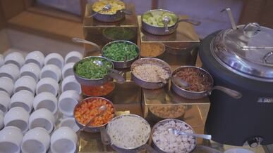 buffet setup with assorted vegetables in bowls