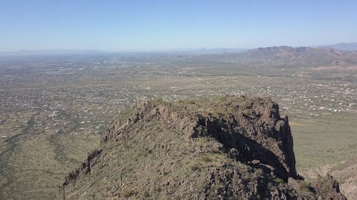 A Large Valley Surrounded By Superstition Mountains In Arizona