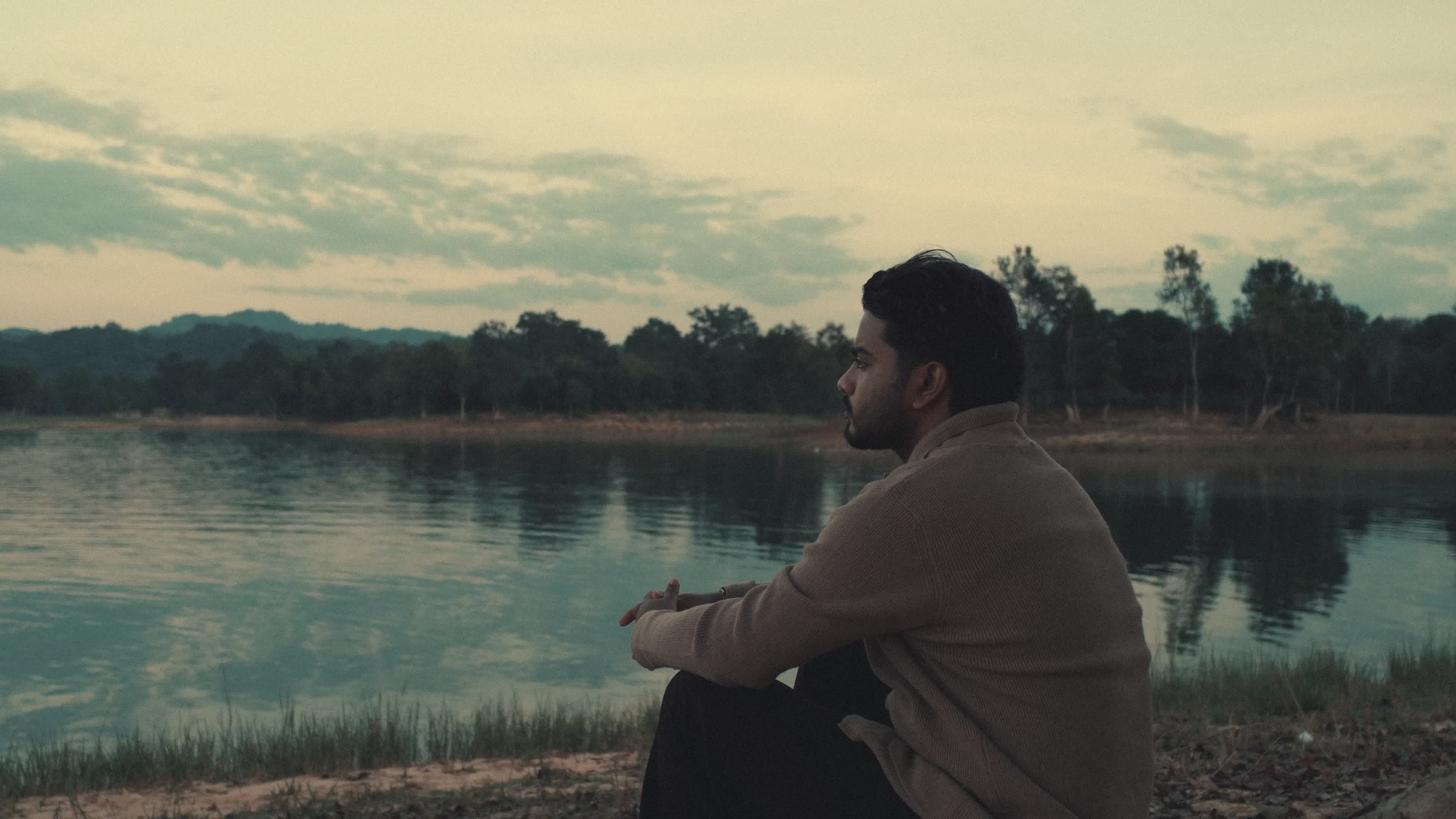 Contemplative Man By Scenic Lake at Sunset Free Stock Video Footage ...