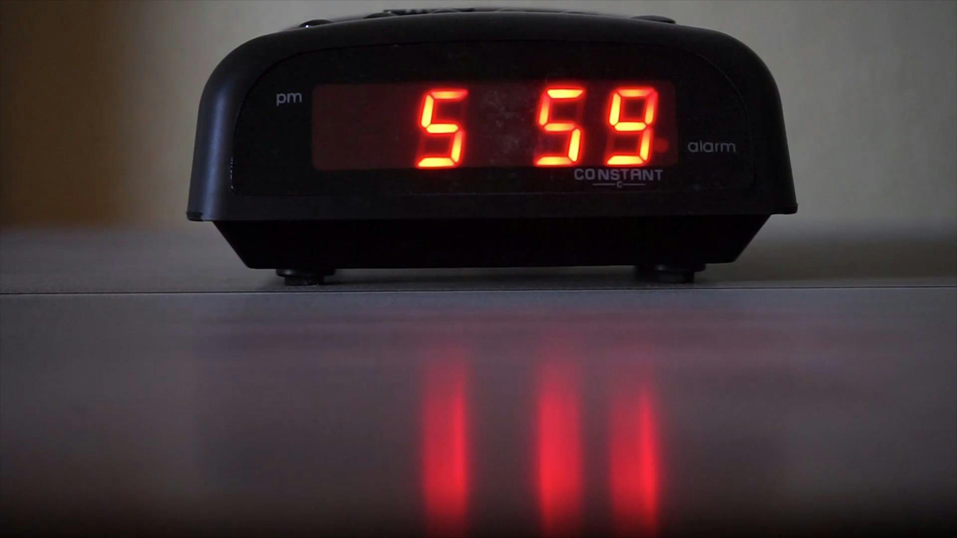 A digital alarm clock displaying time free stock video