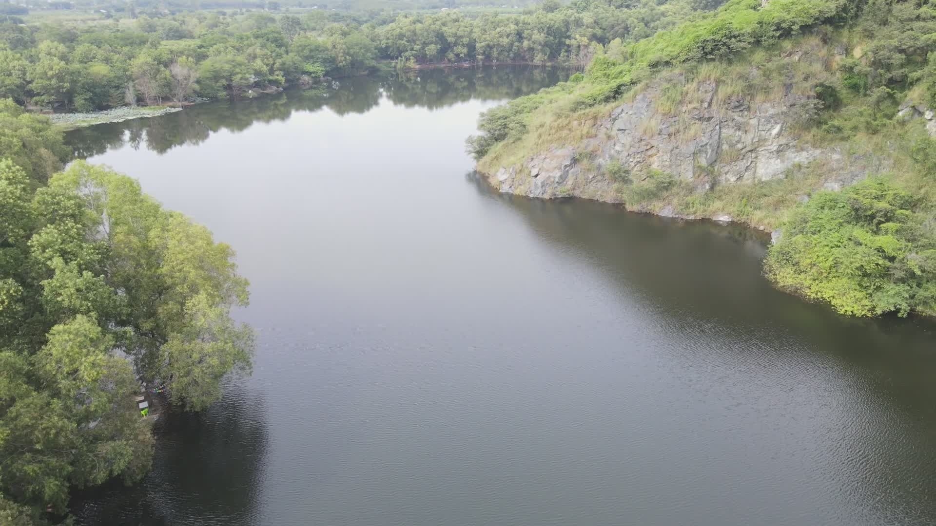 Aerial View of Serene Forested Lake and Cliffs Free Stock Video Footage ...