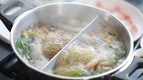 Cooking A Hot Pot Meal Over A Portable Stove 
