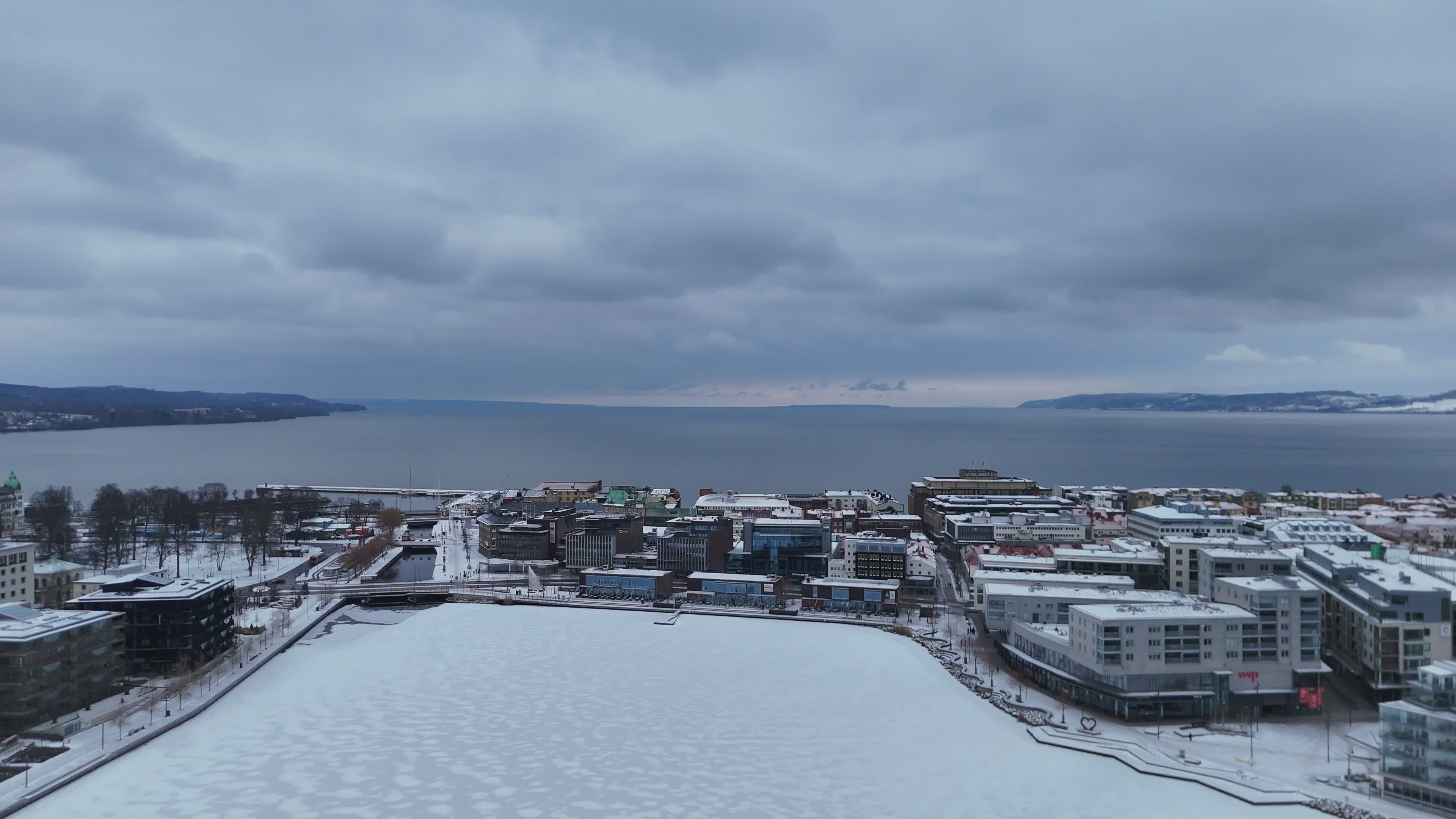 Aerial View of Snowy Coastal Town in Winter Free Stock Video Footage ...
