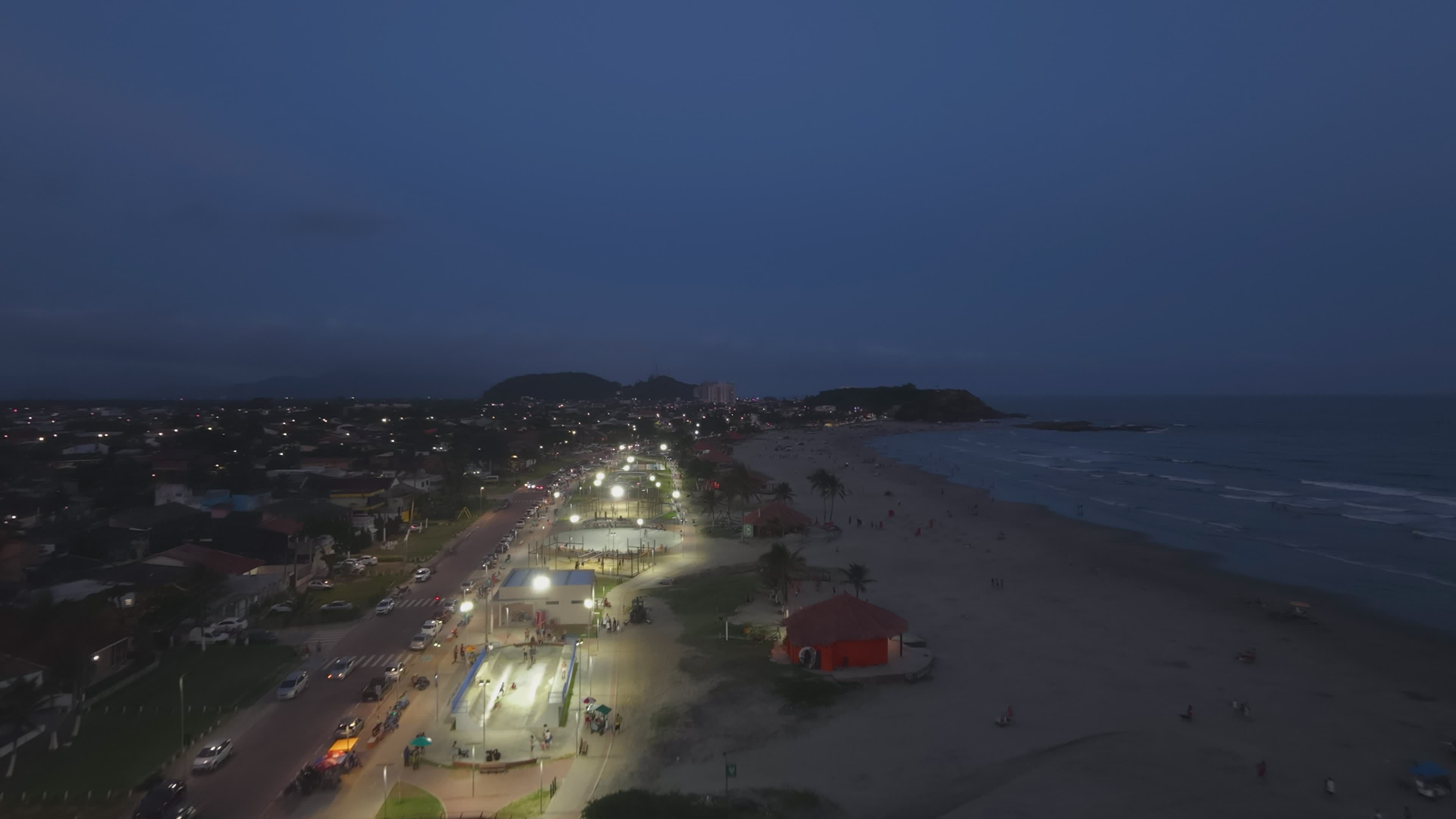Scenic Nighttime Aerial View of Coastal City Beach Free Stock Video ...