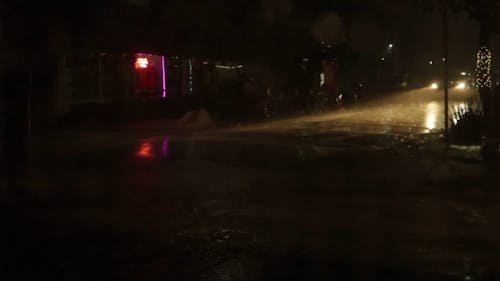 Vehicles Traveling On A Rainy Night