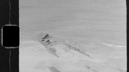 Vintage Video of a Rock In a Beach