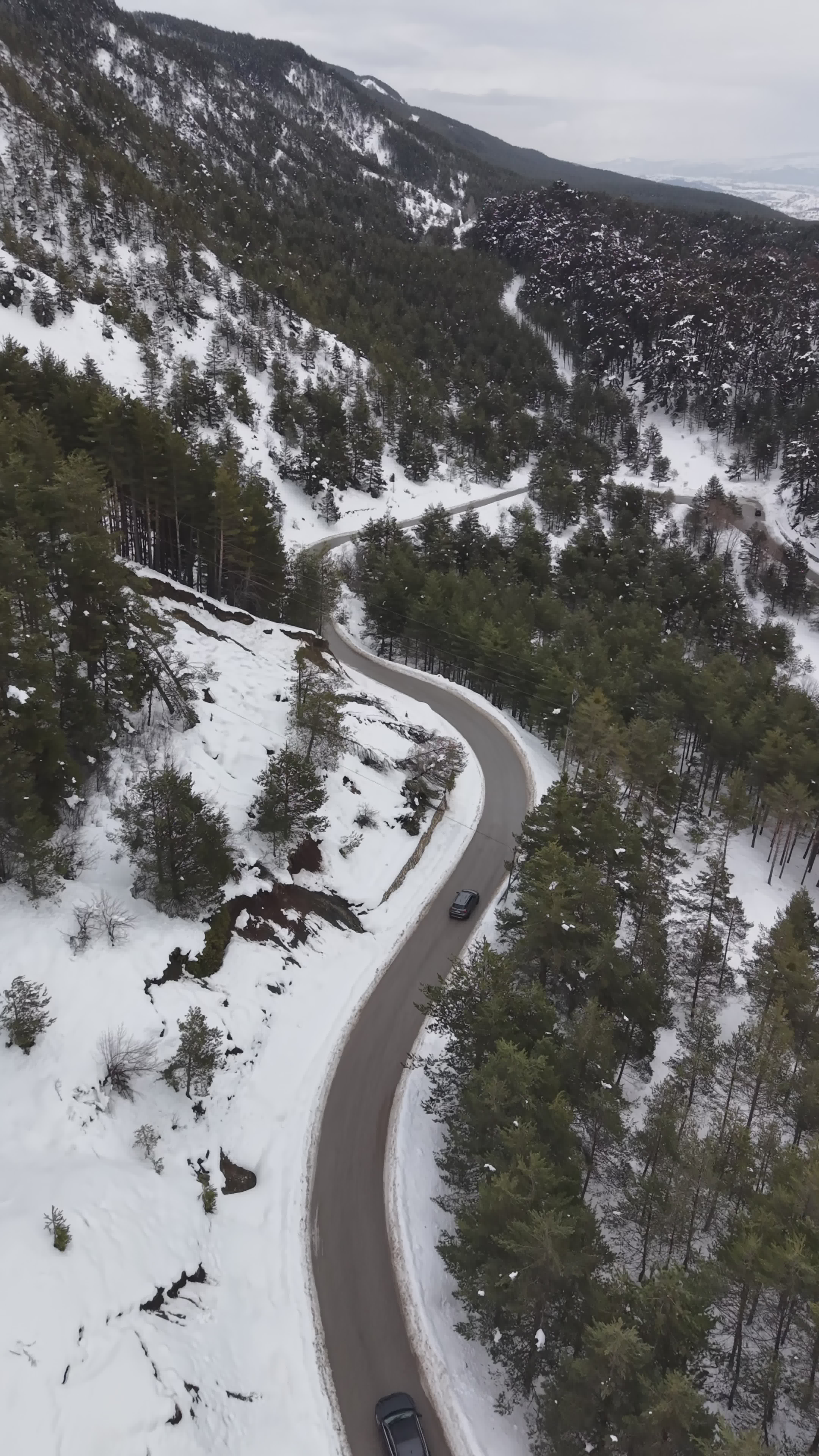 Scenic Aerial View of Snowy Forest Road Free Stock Video Footage ...