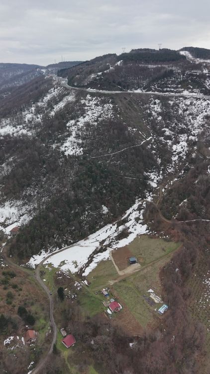 Scenic Winter Aerial View of Snowy Mountain Paths Free Stock Video ...