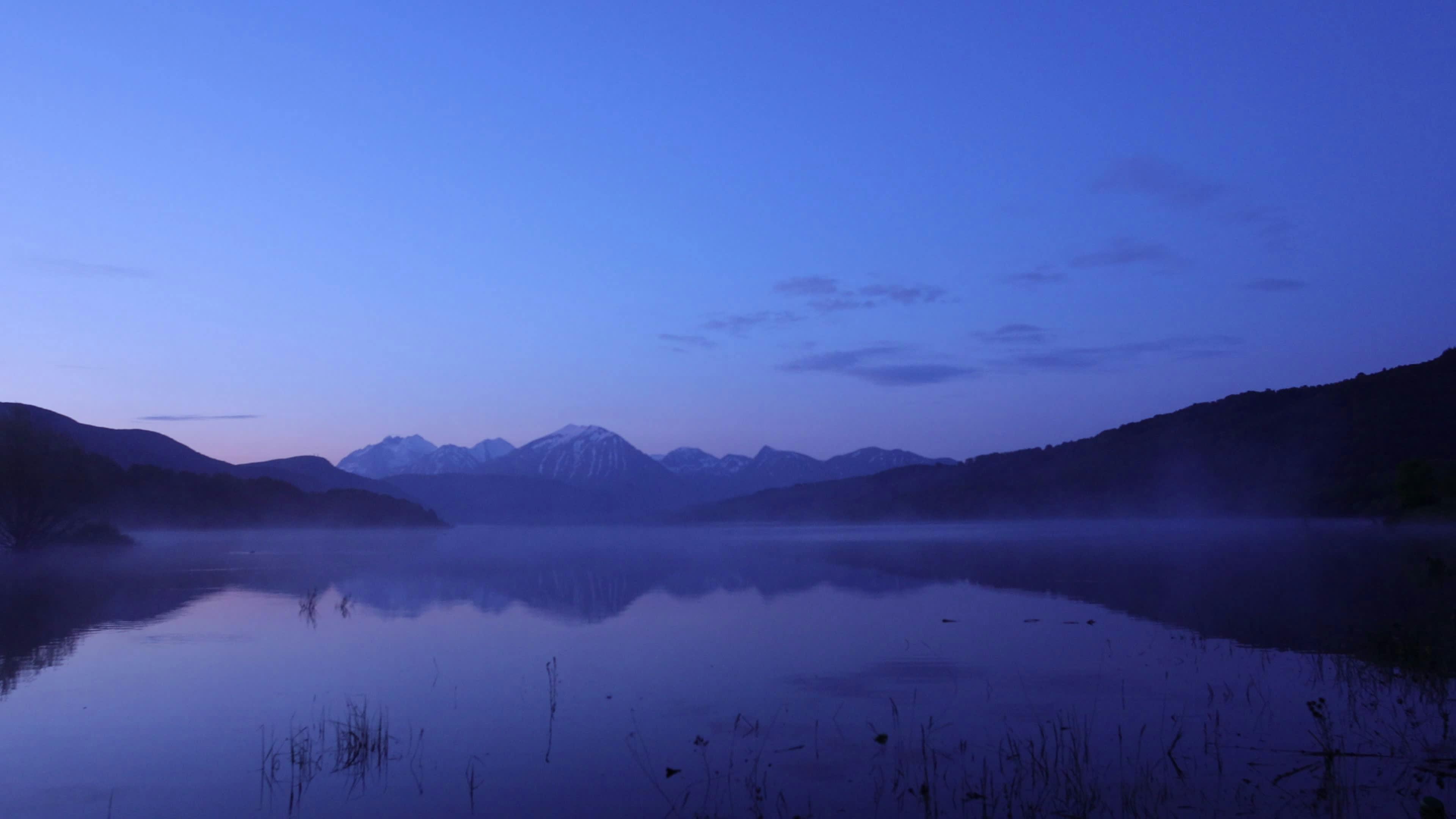serene blue hour at mountain lake 35997189