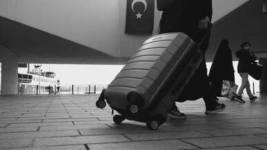 black and white cityscape with commuters