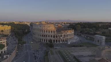 aerial view of the majestic colosseum at sunset