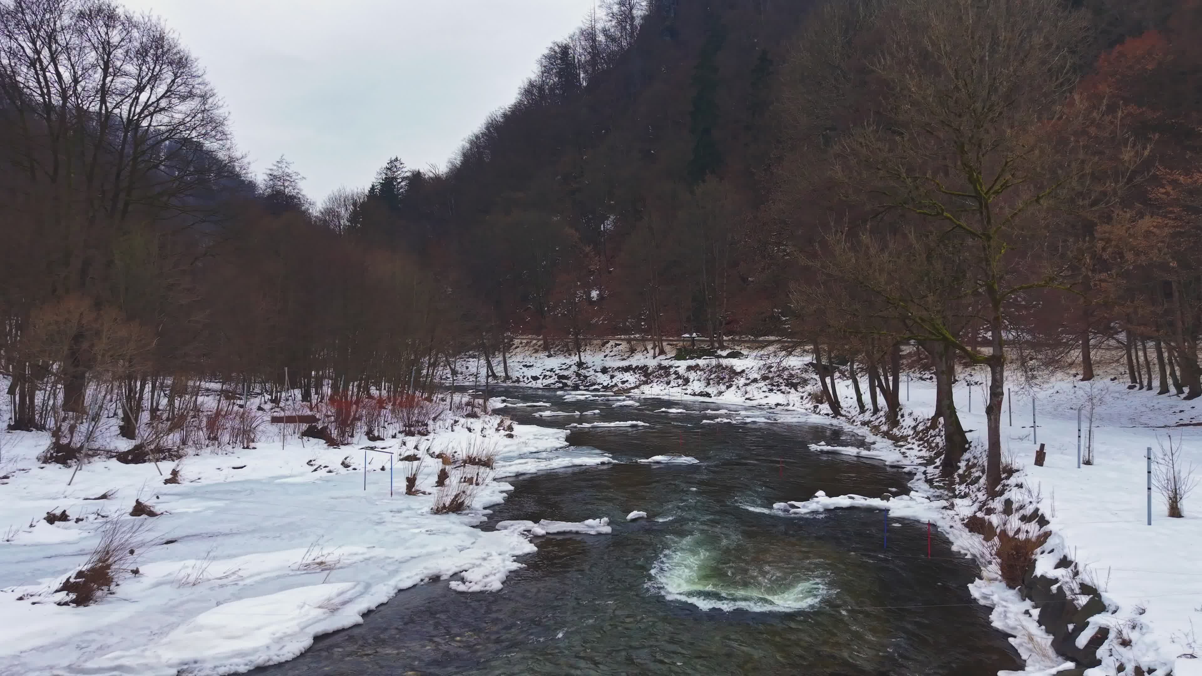 Serene Winter River Flowing Through Snowy Forest Free Stock Video ...